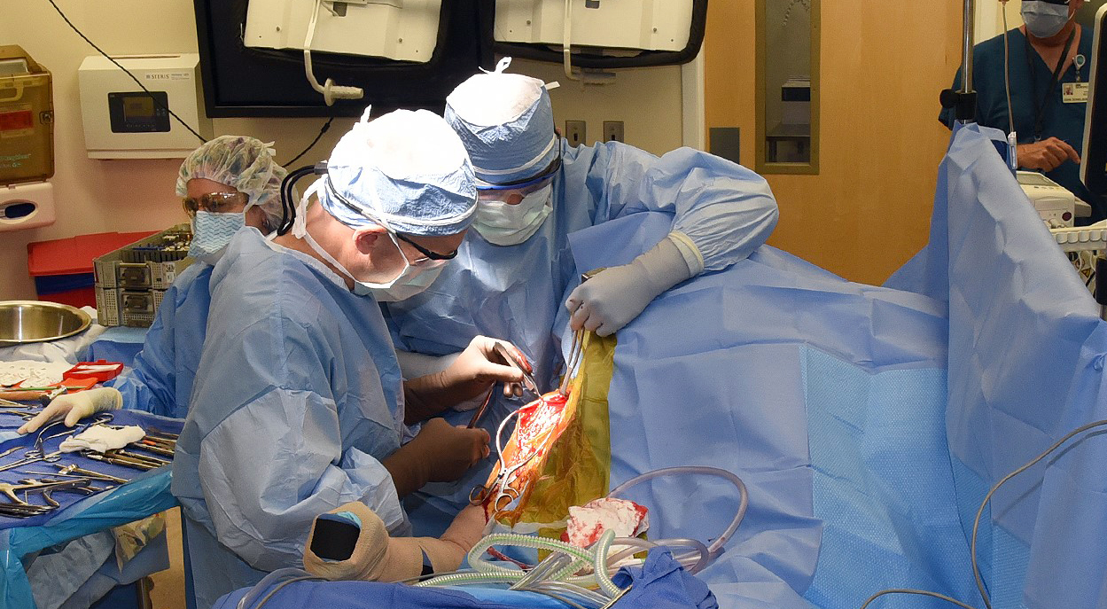 Doctors performing shoulder surgery