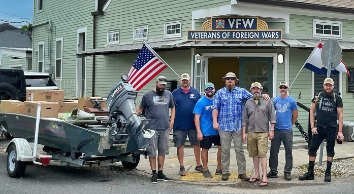 Seven men standing in front of VFW building