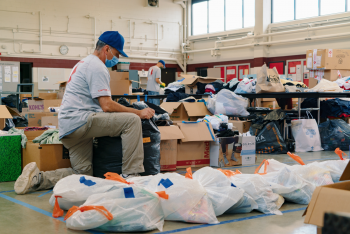 volunteers packing supply packages