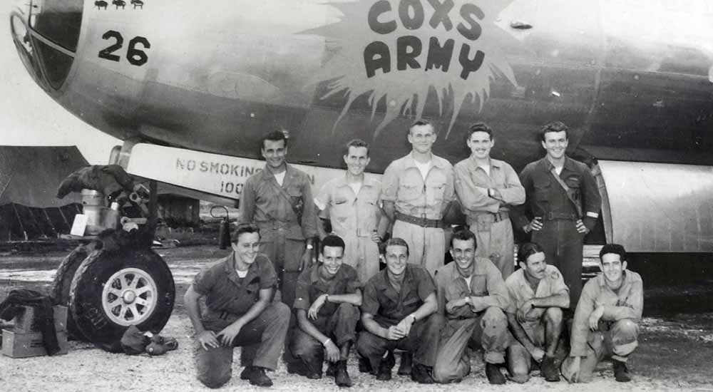 Eleven crew members next to their B-29 Superfortress