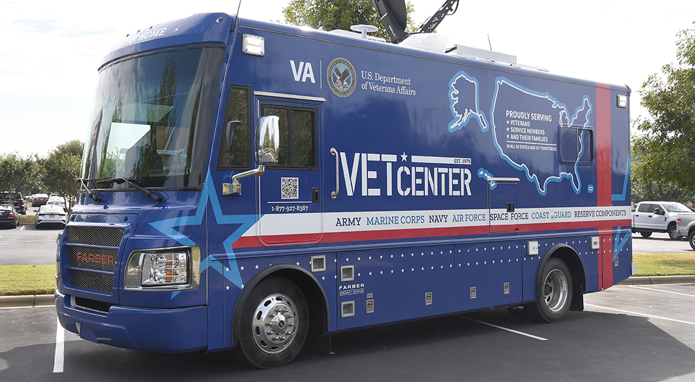 Large blue mobile Vet Center bus