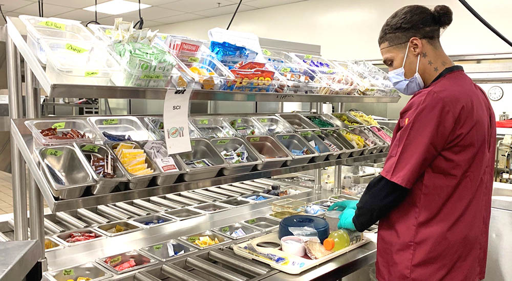 VA employee prepares meals for Veterans