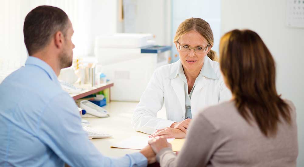 Doctor meets with patient and caregiver