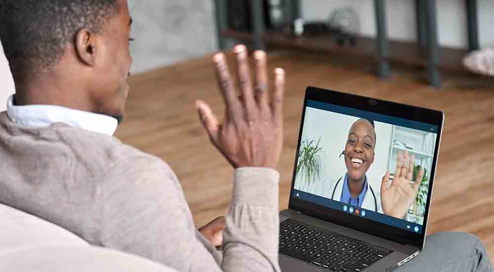 Veteran conducting Video Connect telehealth appointment