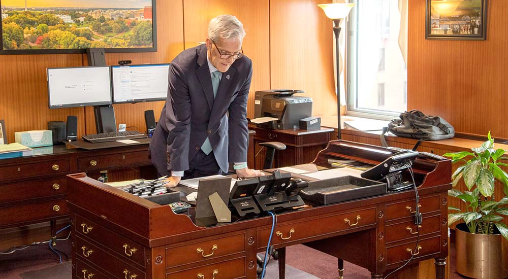 VA Secretary on office speaker phone regarding Salute Week
