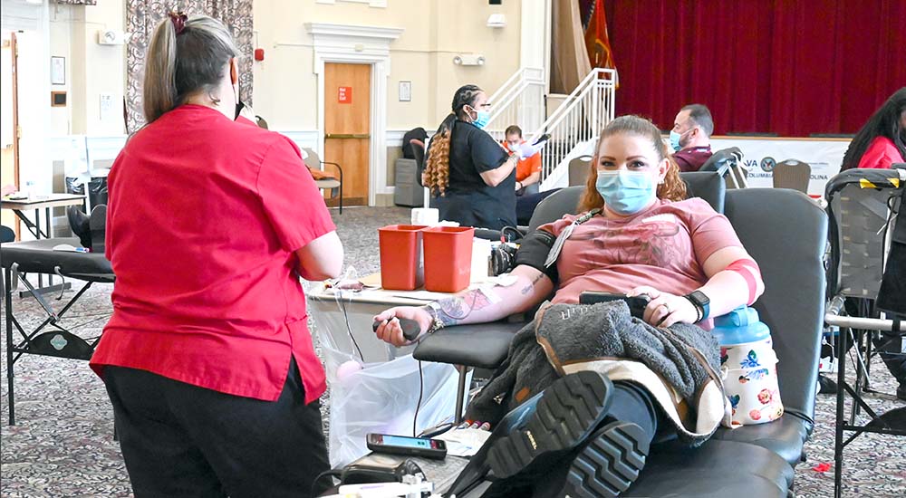 Woman on recliner donating blood