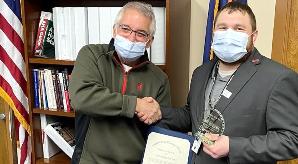 Hospital director congratulates Employee of the Year