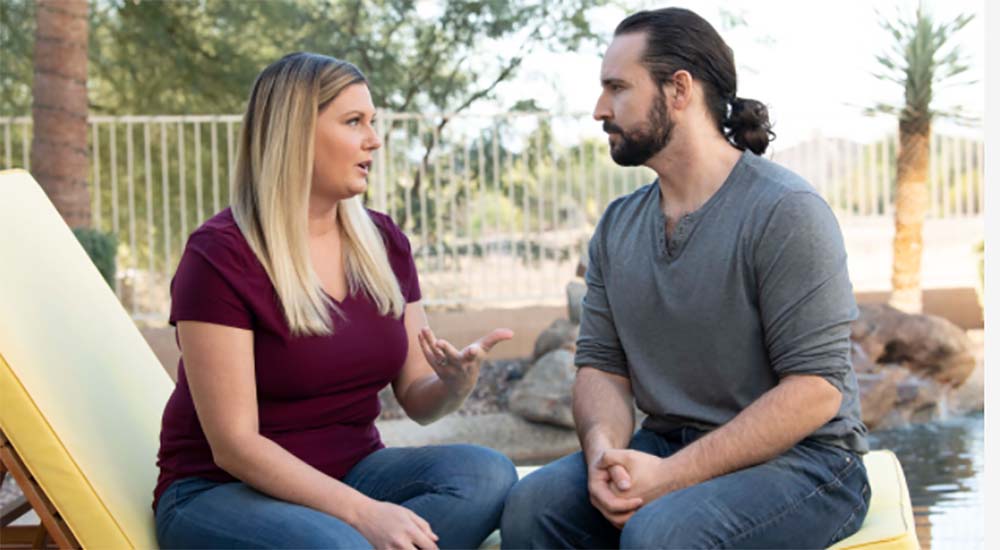 Man and woman talking through conflict