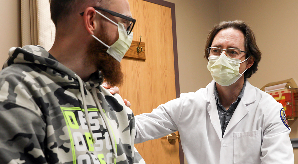 Doctor talking with Veteran patient at Arkansas' best hospital