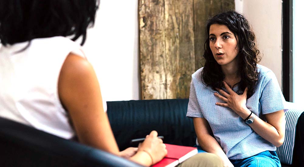 Woman receiving postvention counseling