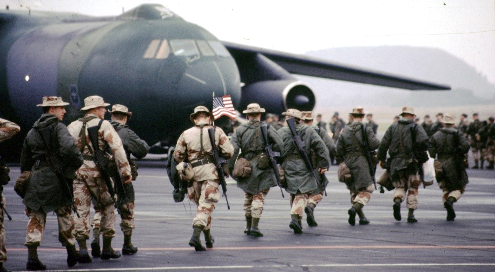 Line of Gulf War soldiers boarding aircraft, invited to research committee engagement sessions