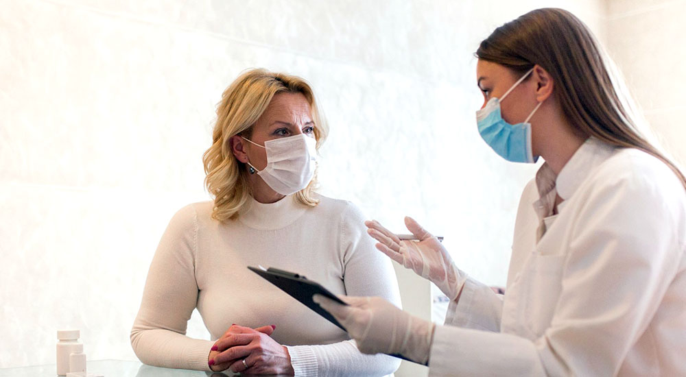 Nurse discusses women's care with patient