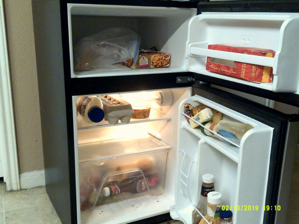 "[This is a picture of what was] in my fridge when I first started the project. You see [there's] hardly anything in there? And see how small the fridge is?"