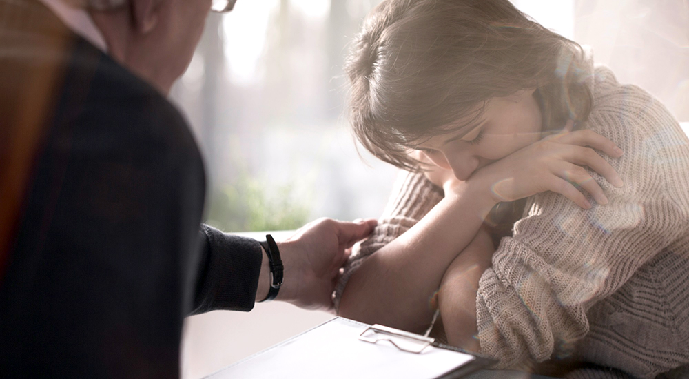 Counselor comforting sad homeless woman, we believe