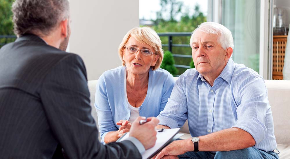 Senior couple meeting with advance care planning adviser