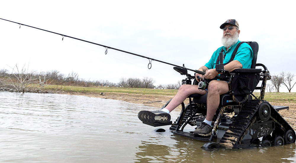 Veteran fishing from track chair