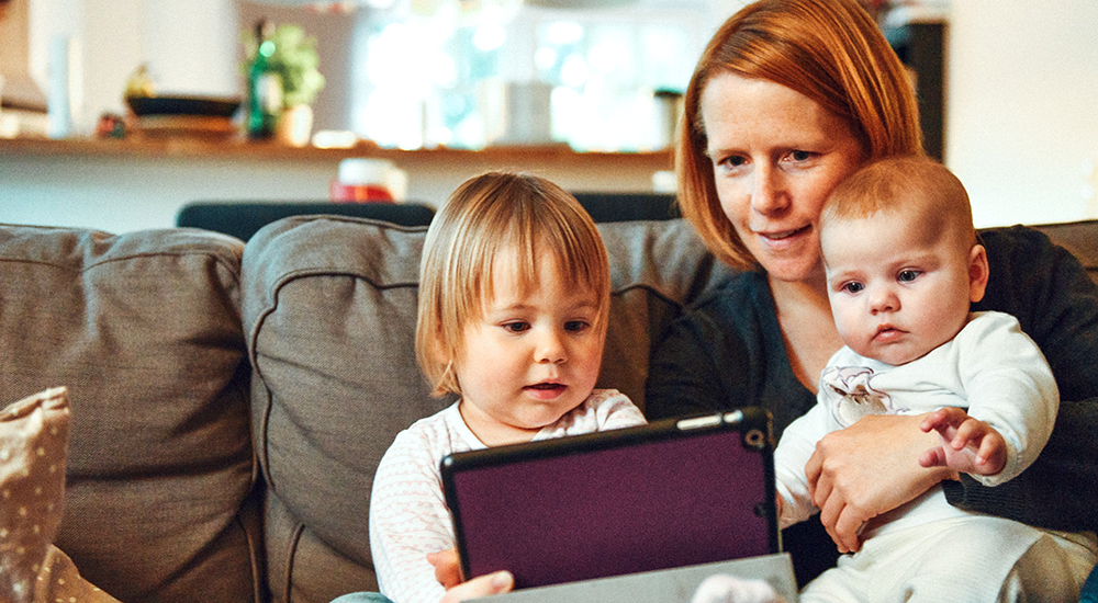 Woman with two babies on telehealth call