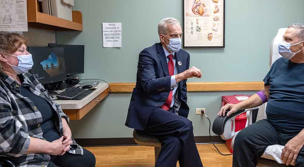 VA secretary talks with Veteran patient and his wife at the Hines VA
