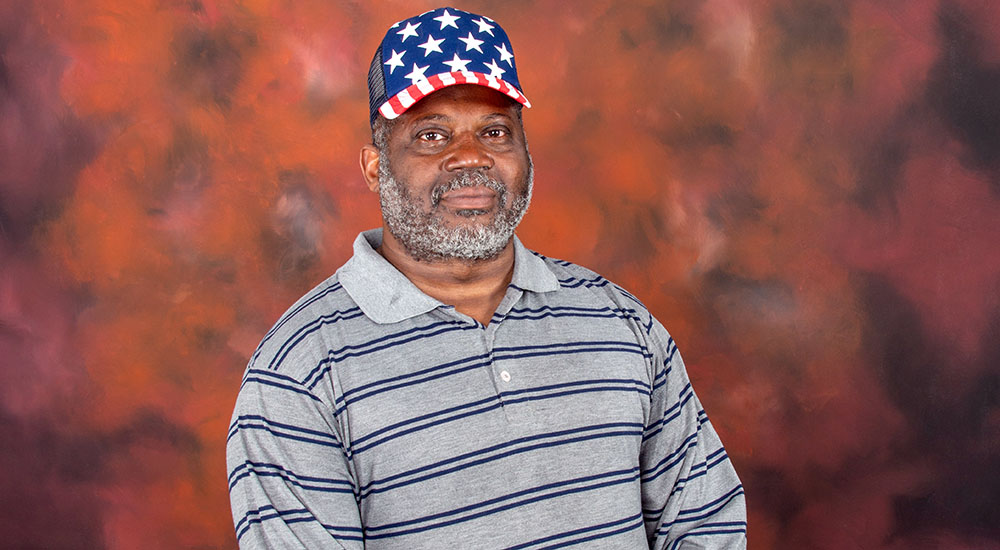 Army Veteran Henry Howard in stars and stripes cap