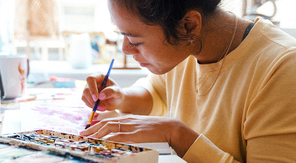 Woman displaying her creative skills by painting