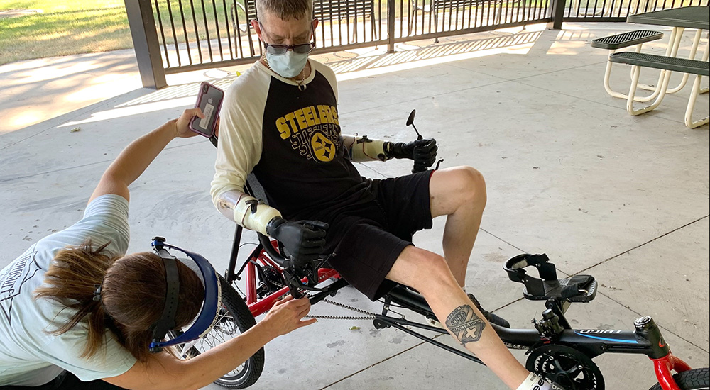 Occupational therapist adjusts Veteran’s bicycle