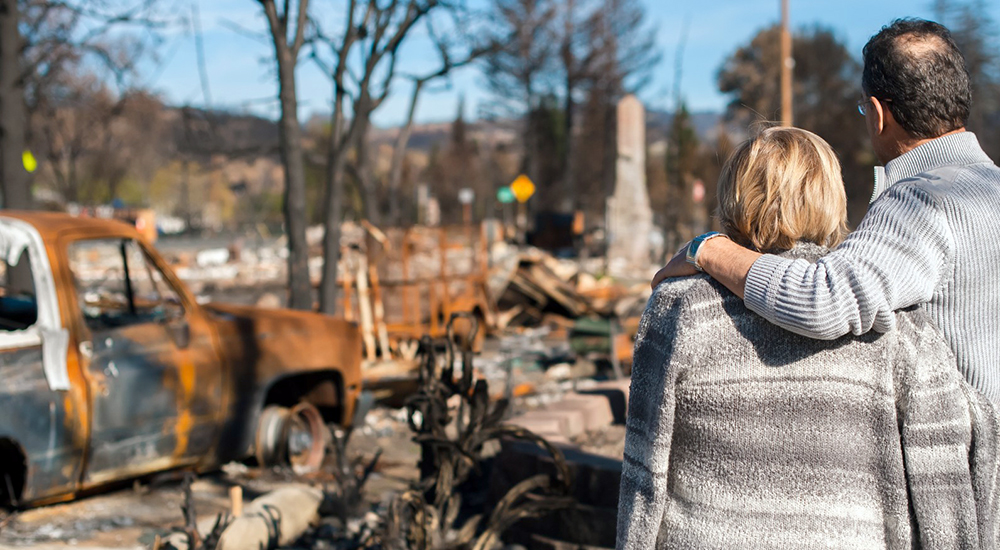 Couple views fire damage to home