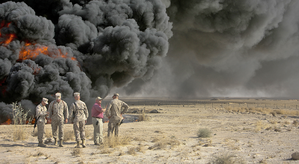 Soldiers in uniform and large black smoke