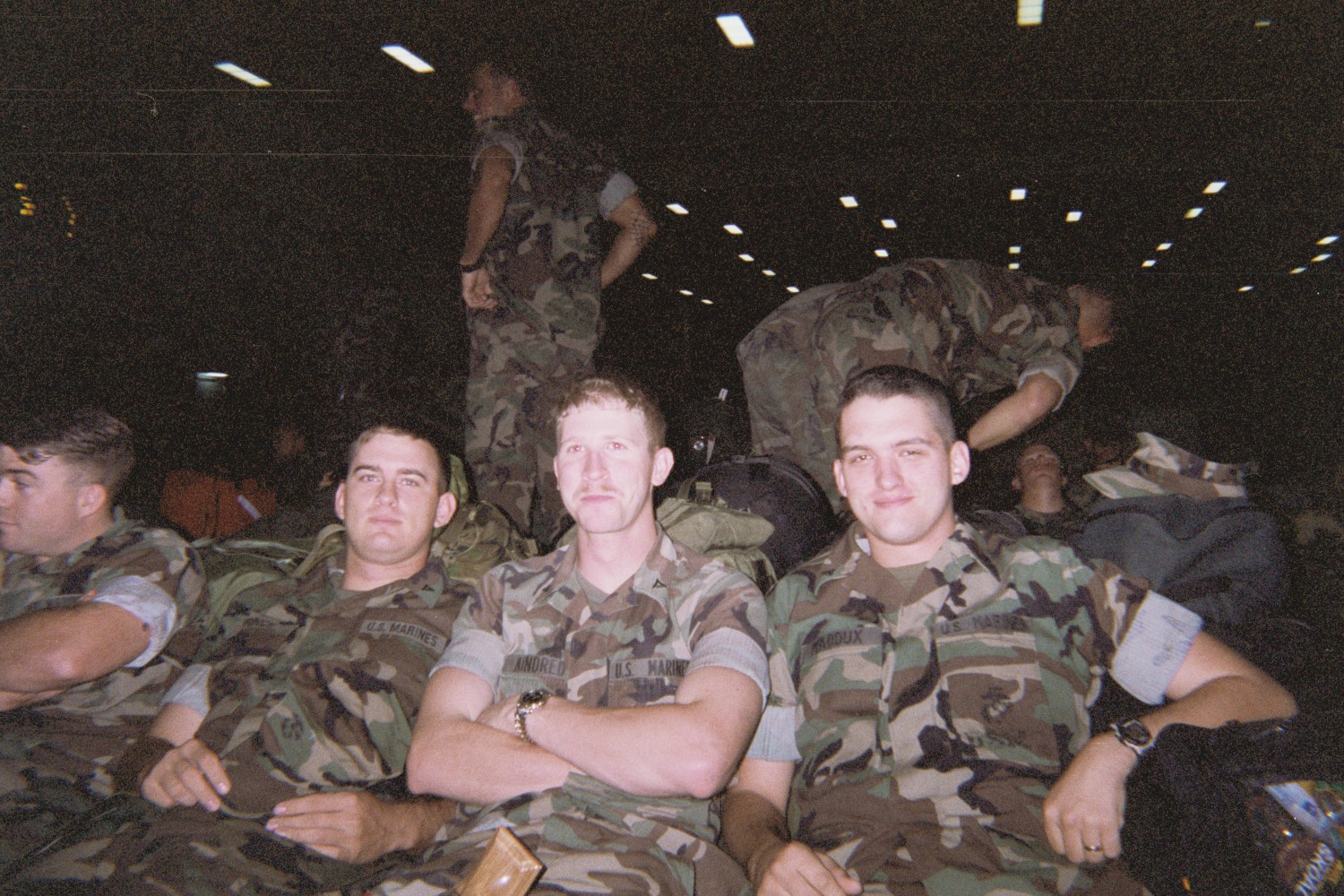 John Kindred (center) with his Marine Corps unit aboard the USS Essex, an amphibious assault ship, in 2001.