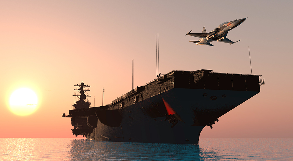 A warship and an airplane on the sea.