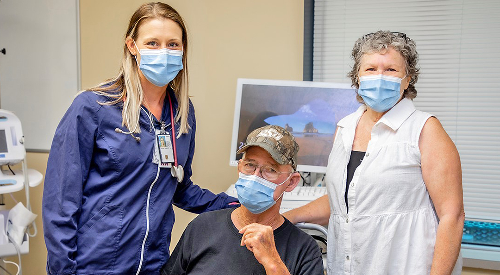 VA Nurse with Veteran patient and his wife at outpatient diuresis clinic