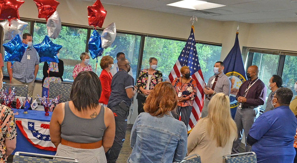 Tour of Duty: Large group standing and taking oath