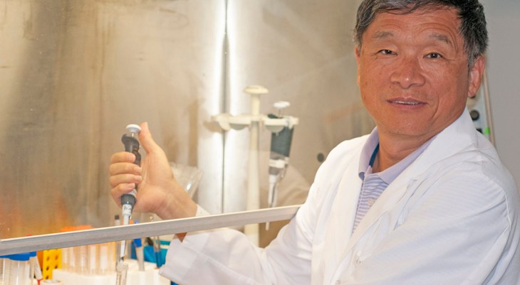 Doctor in laboratory using syringe tube to research colorectal cancer