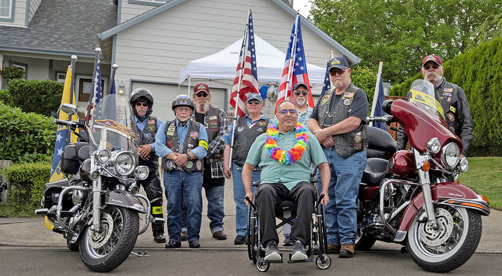 Eight Veterans and their motorcycles and flags, members of the Dream Foundation