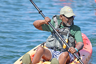 Veteran paddling in kayak