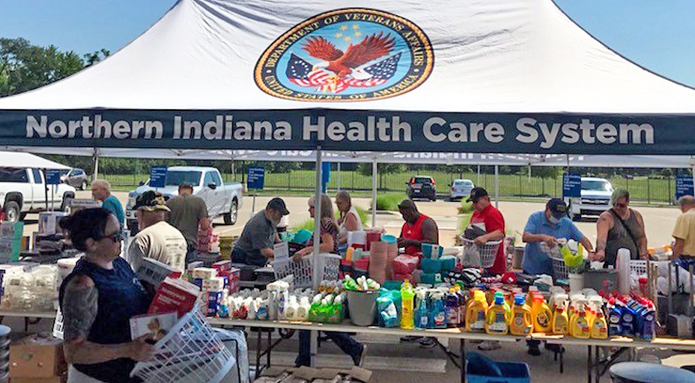 Many people under large tent marked Northern Indiana Health Care System