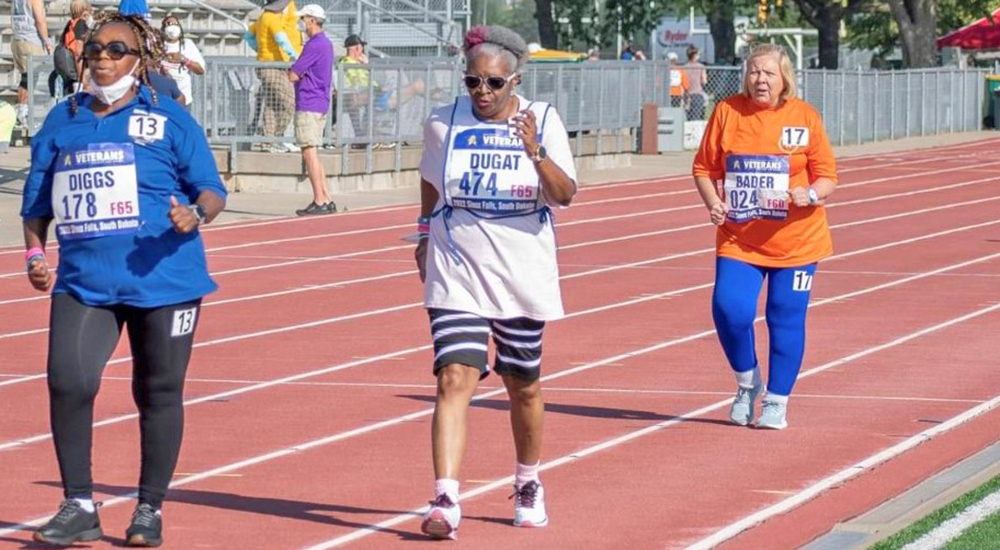 Three woman speed walking in competition; Houston Golden Age Games