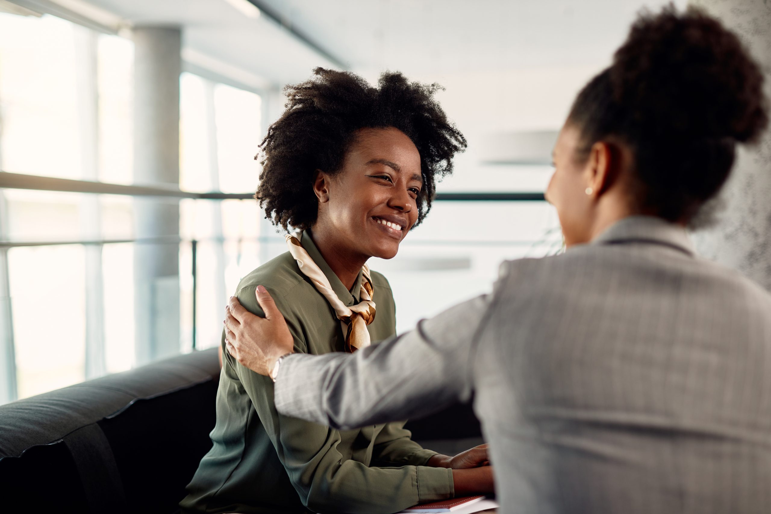 two women in business attire one is a mentor