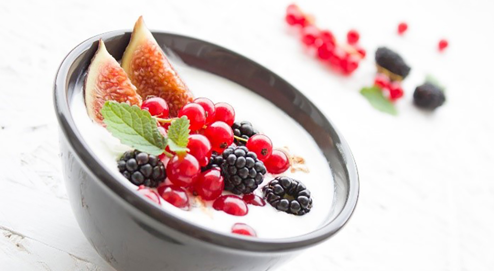 Yogurt with fruit on top; breakfast