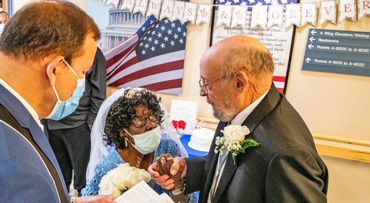 Newly married couple exchange wedding vows