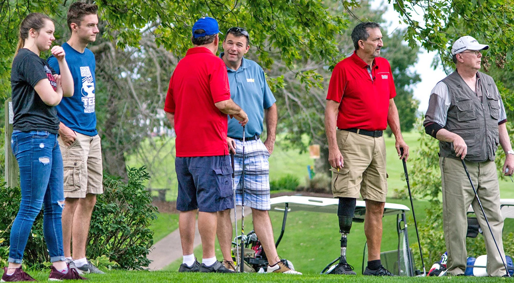 Six people waiting to tee off