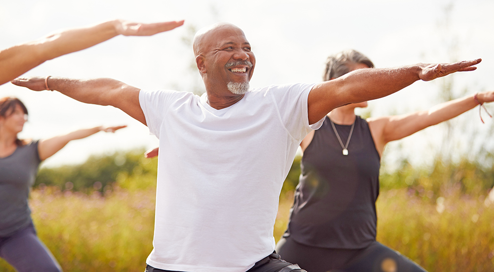 Group of people exercising; caregiver support program coaching