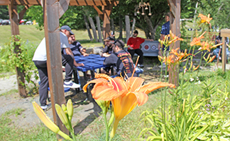 Recovery group meeting under an arbor