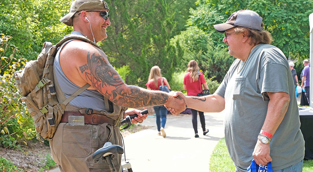 Two Veterans shaking hands; health summit