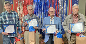 Four senior Veterans and their flu shot awards