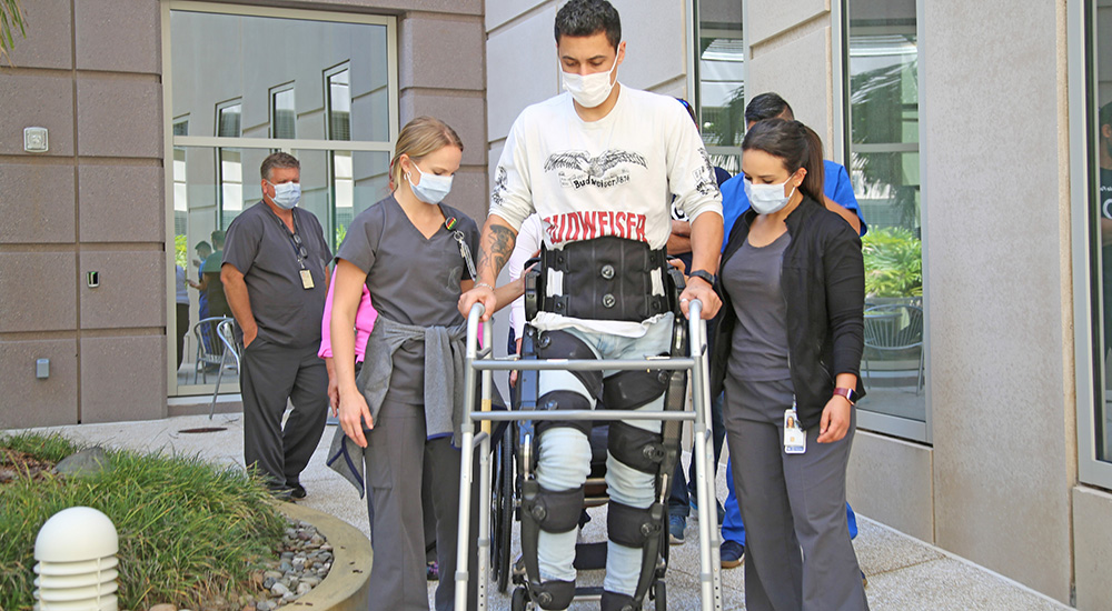 Veteran walking with robotic suit