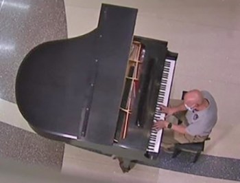Man playing piano in VA lobby