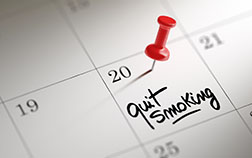 Calendar with red pushpin on quit smoking date