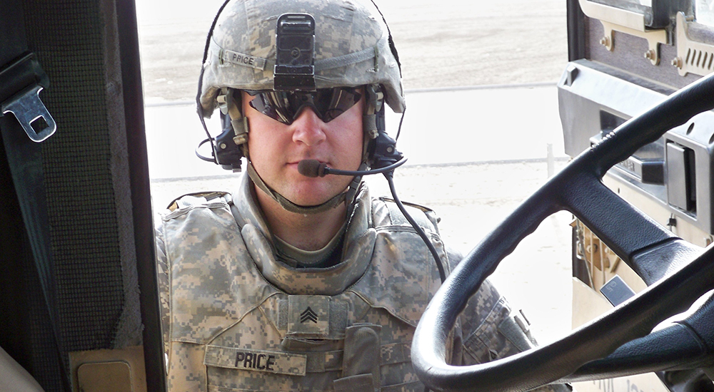 Army soldier beside vehicle; multiple sclerosis