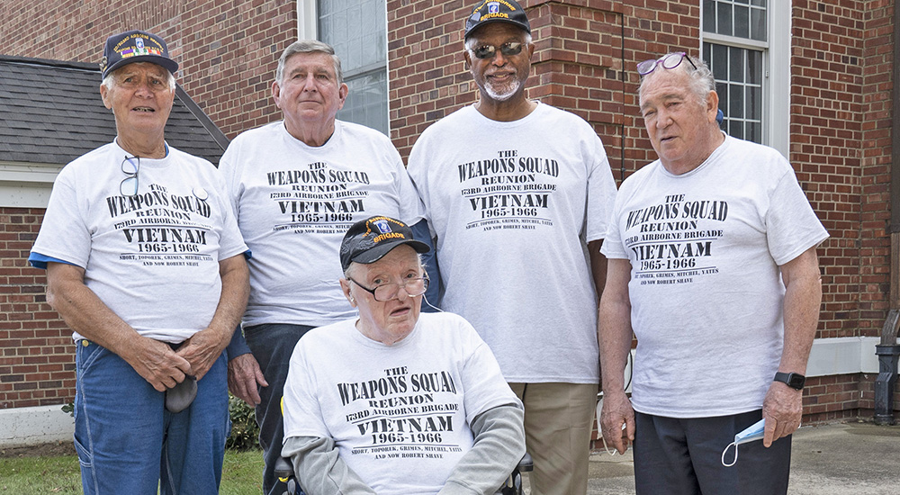 Five Veterans in reunion t-shirts