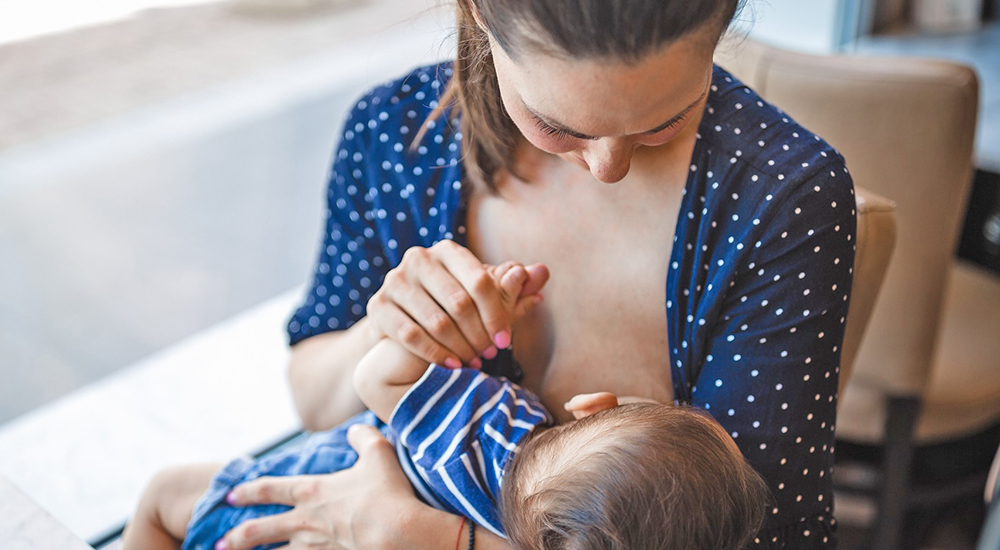 Woman breastfeeding an infant; women Veterans